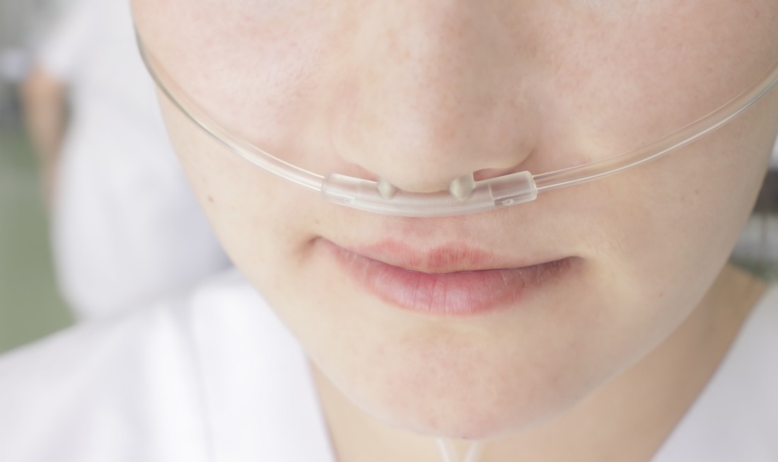Breathing through a plastic nasal catheter during illness