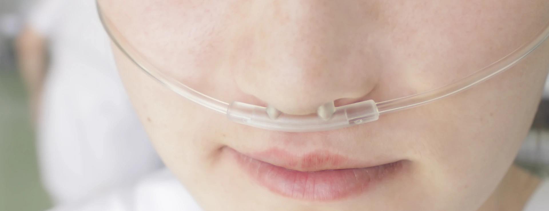 Breathing through a plastic nasal catheter during illness