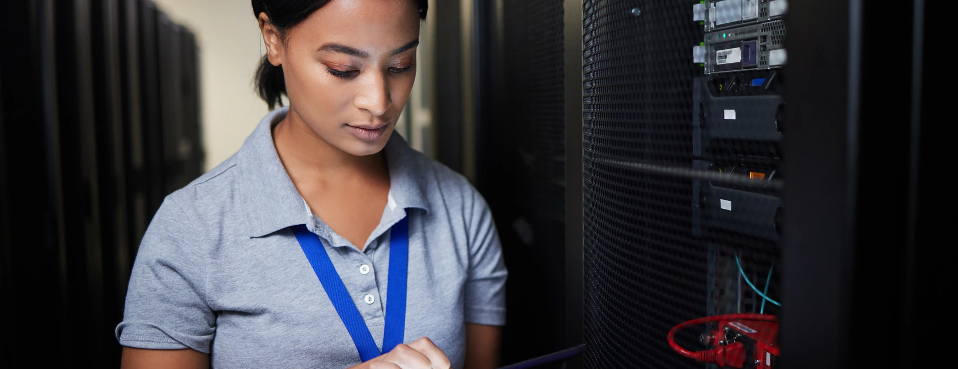 Woman, tablet and server room, programming or coding for cybersecurity, information technology or data protection backup. Engineering person on digital software, hardware inspection or basement check
