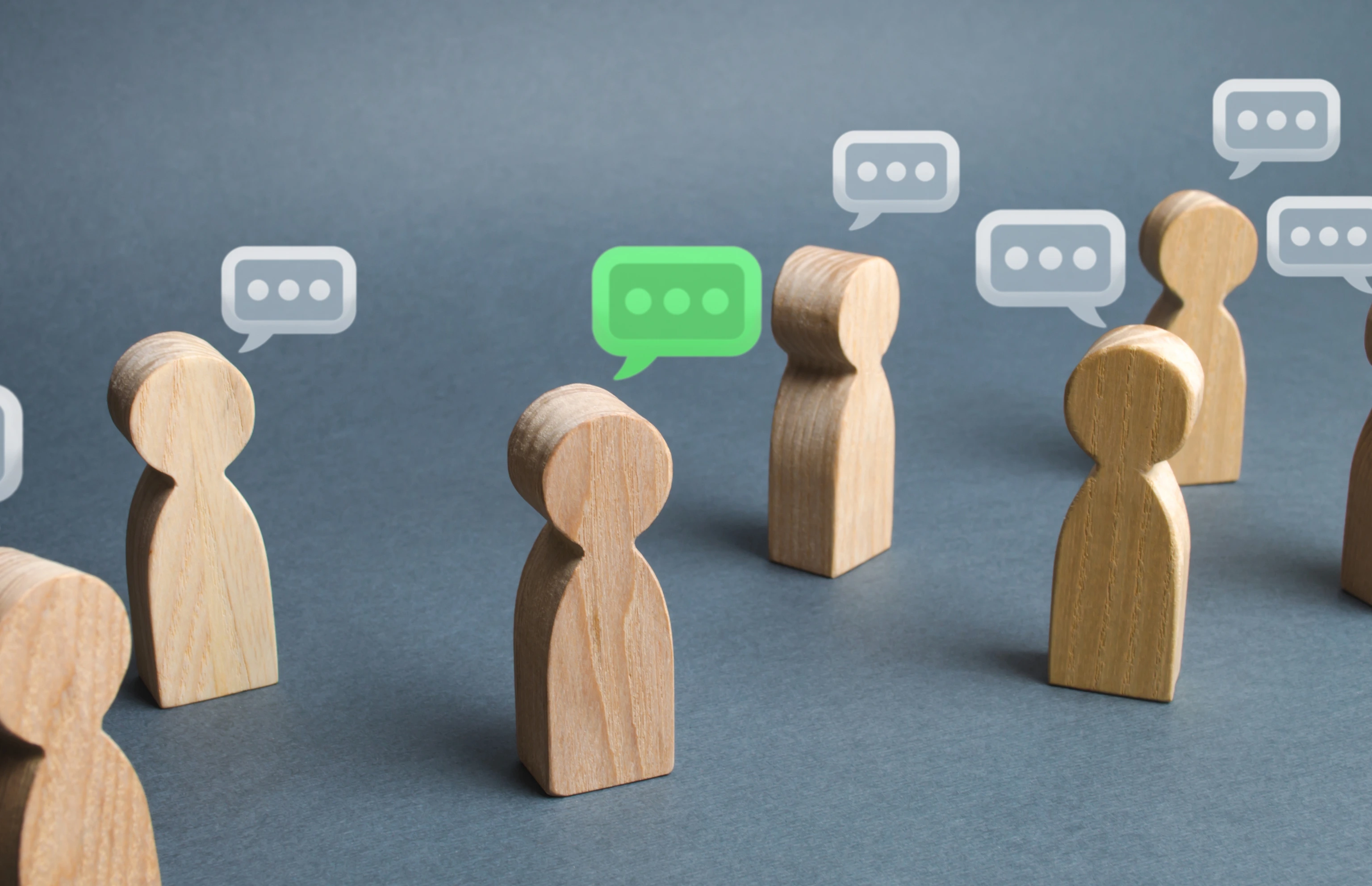 A lot of people figures and comment clouds above their heads.