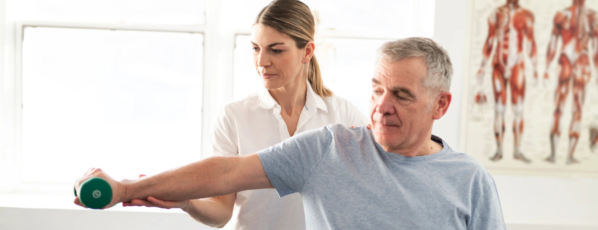 A Modern rehabilitation physiotherapy worker with senior client