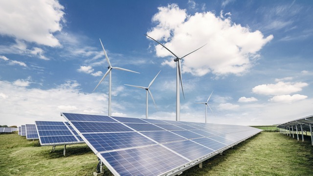 Gorundmounted PV Plant with Wind turbines in background