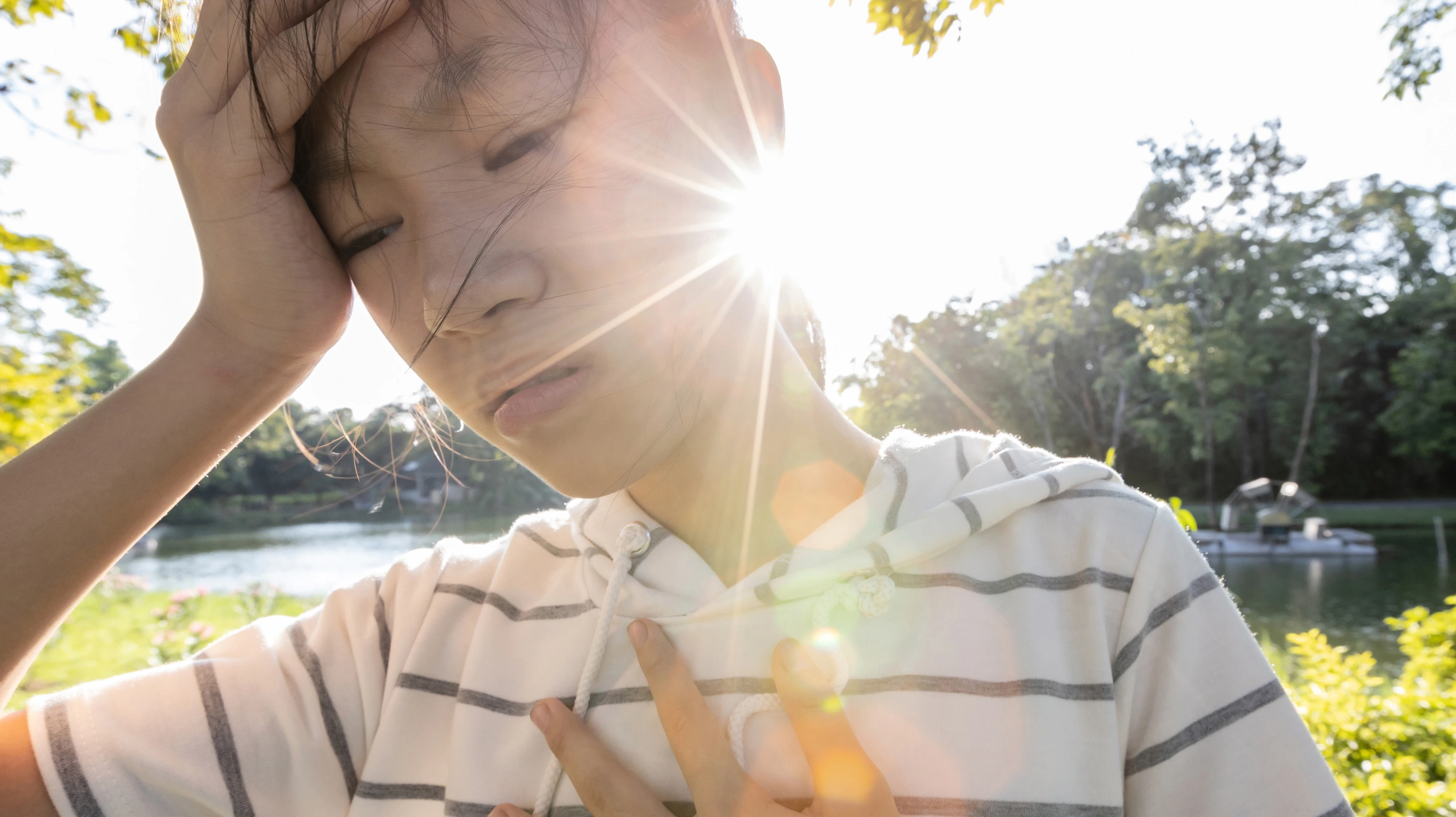 Tired asian woman suffer from sunburn very hot in summer weather problem feel faint,dizzy,difficulty breathing,female teenage with heat stroke,high temperature,burning heat wave hot sun on sunny day