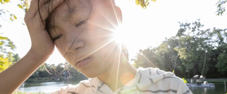 Tired asian woman suffer from sunburn very hot in summer weather problem feel faint,dizzy,difficulty breathing,female teenage with heat stroke,high temperature,burning heat wave hot sun on sunny day