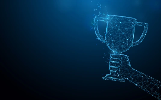 Hand holding trophy cup