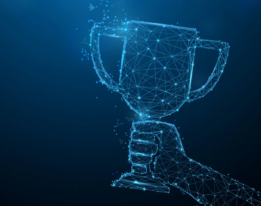 Hand holding trophy cup