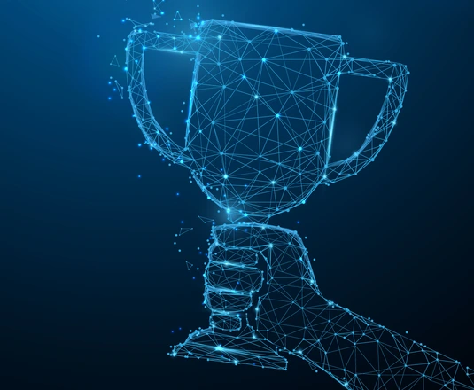 Hand holding trophy cup
