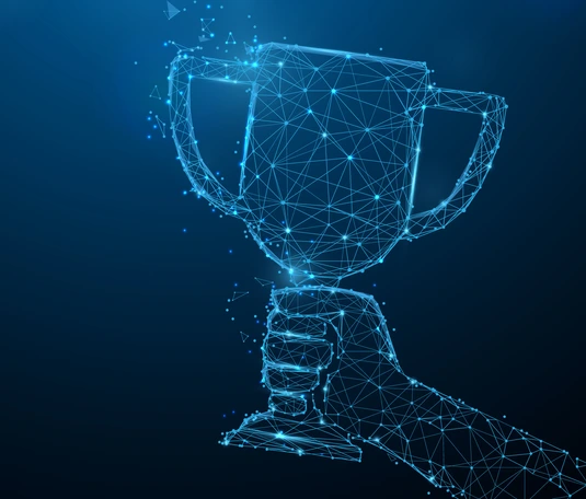 Hand holding trophy cup