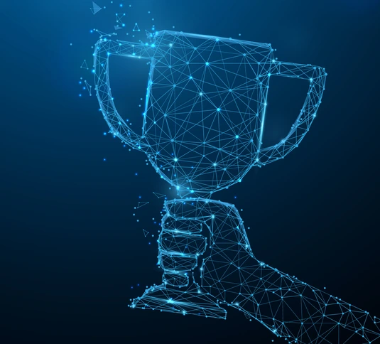 Hand holding trophy cup