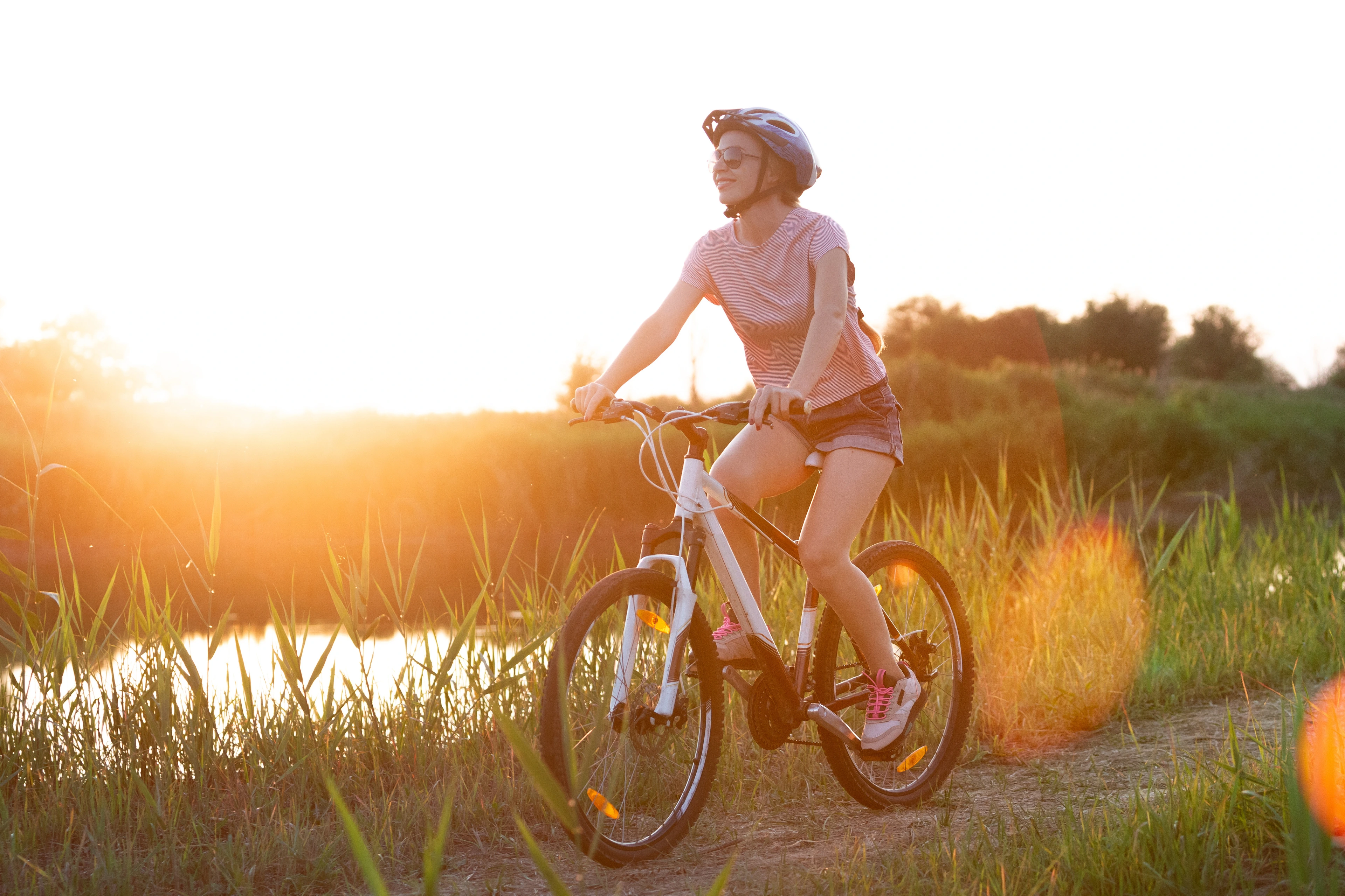 Women with bike in nature