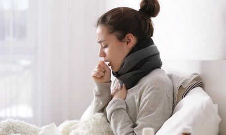 Young ill woman in bed at home