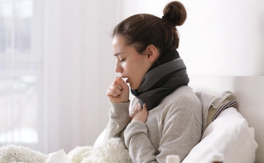 Young ill woman in bed at home