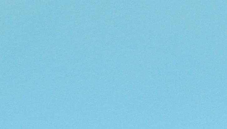 Woman using glucometer on blue background, top view