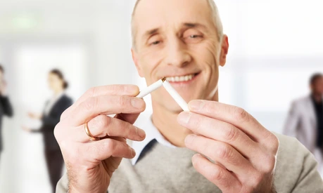 Successful man with broken cigarette