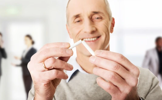 Successful man with broken cigarette