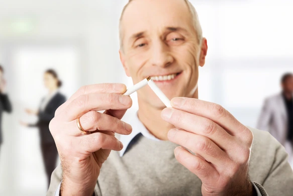 Successful man with broken cigarette