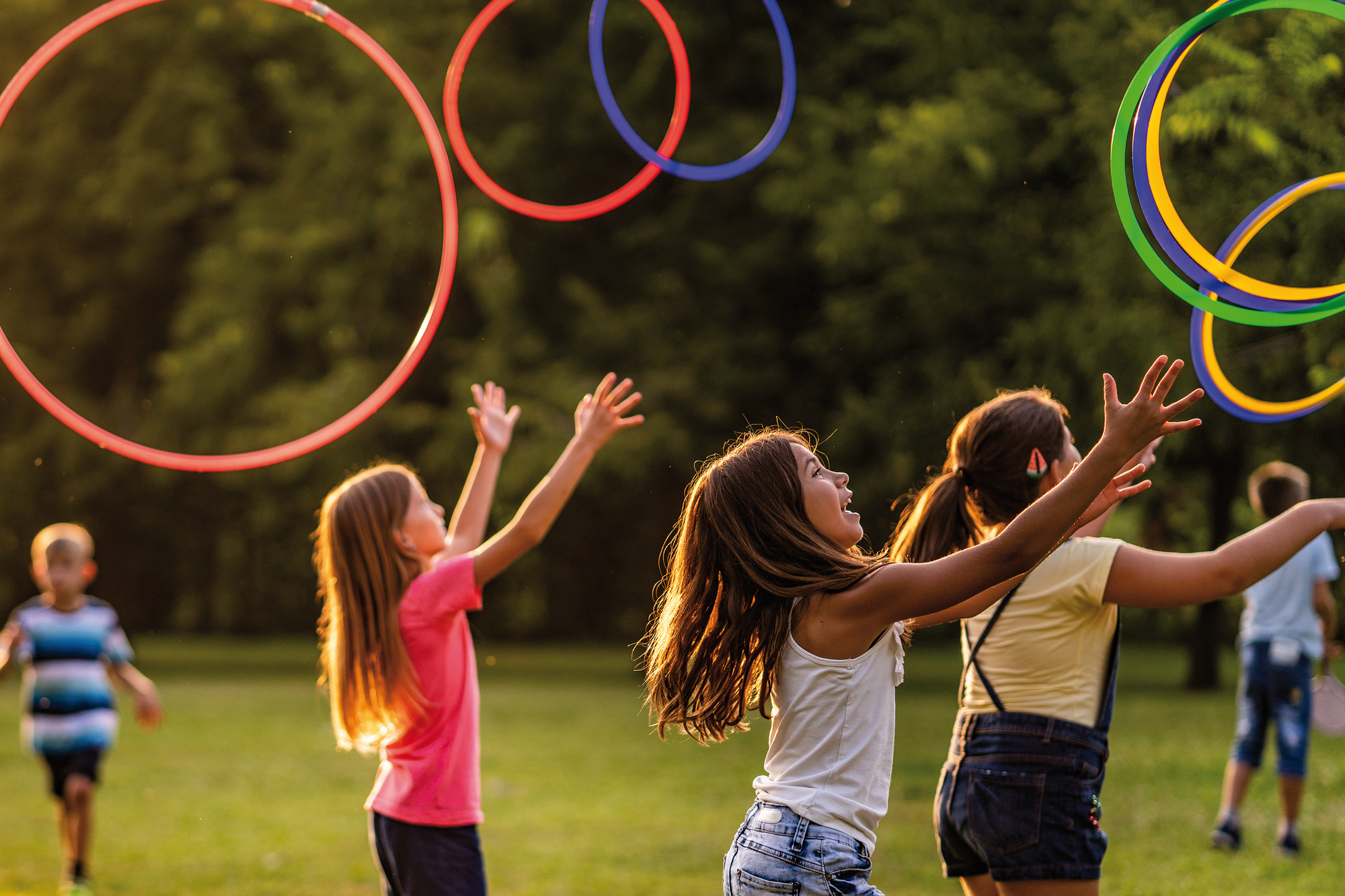 Kids throwing a plastic hoops in the park