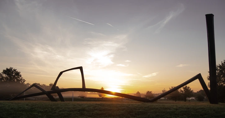 Helmholtz Munich Campus - Sculpture in front of sunrise