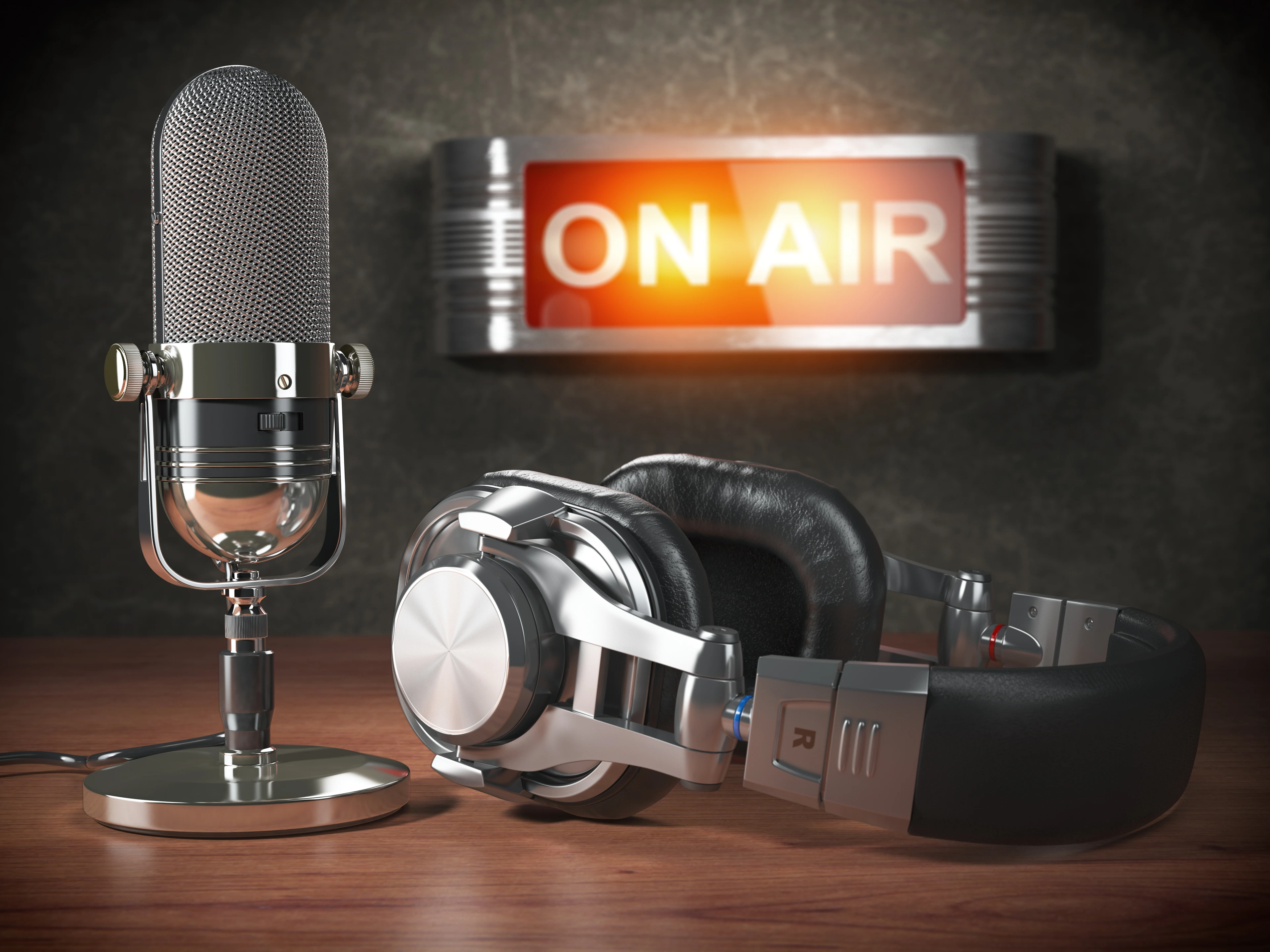 Vintage microphone  and headphones with signboard on air