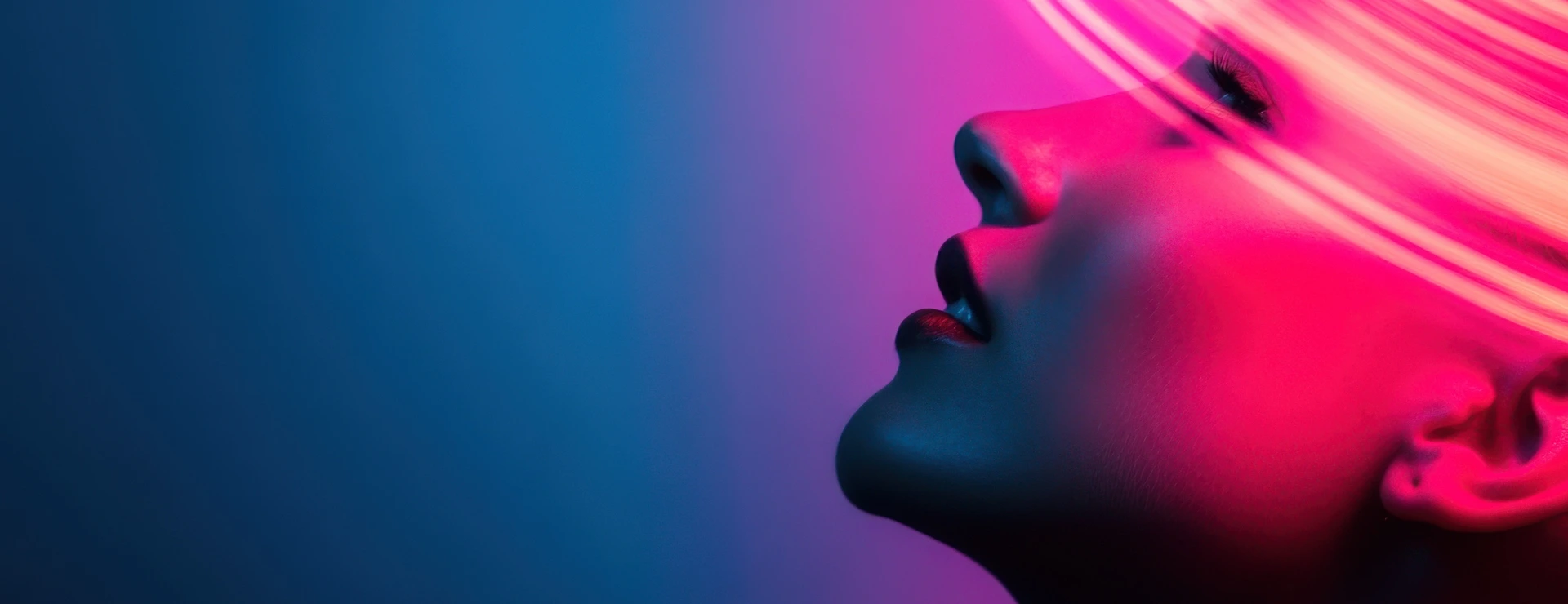 Woman posing under neon lights with blue and purple background