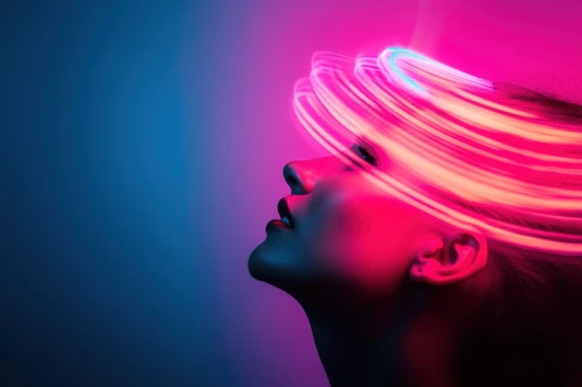 Woman posing under neon lights with blue and purple background