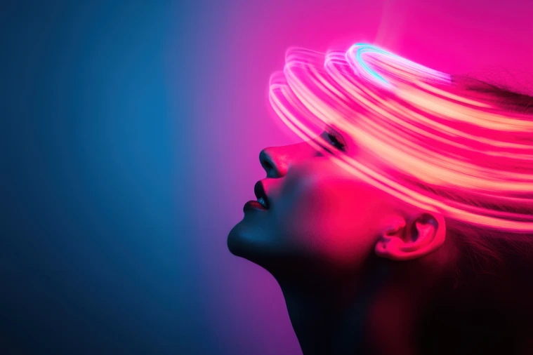 Woman posing under neon lights with blue and purple background