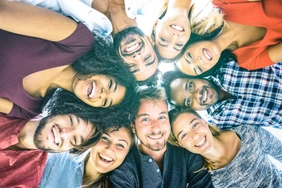 Multiracial best friends millennials taking selfie outdoors with back lighting - Happy youth friendship concept against racism with international young people having fun together - Azure filter tone