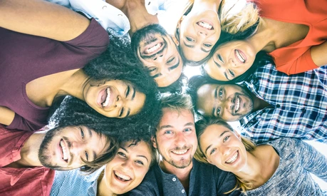 Multiracial best friends millennials taking selfie outdoors with back lighting - Happy youth friendship concept against racism with international young people having fun together - Azure filter tone