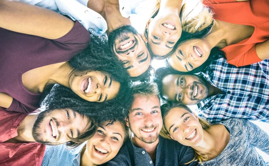 Multiracial best friends millennials taking selfie outdoors with back lighting - Happy youth friendship concept against racism with international young people having fun together - Azure filter tone