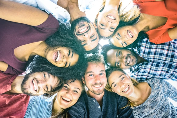 Multiracial best friends millennials taking selfie outdoors with back lighting - Happy youth friendship concept against racism with international young people having fun together - Azure filter tone