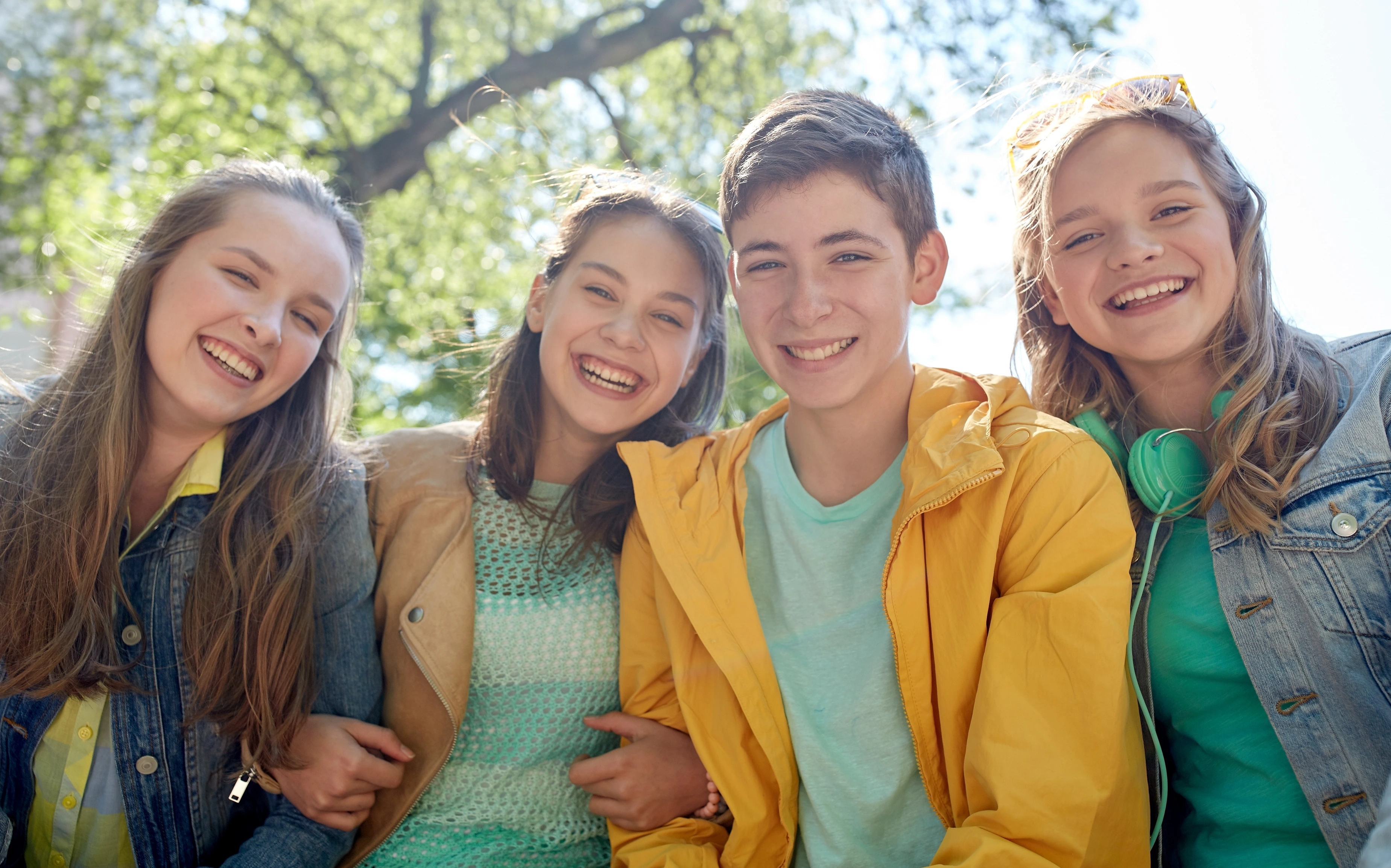 Teenage students or friends laughing together