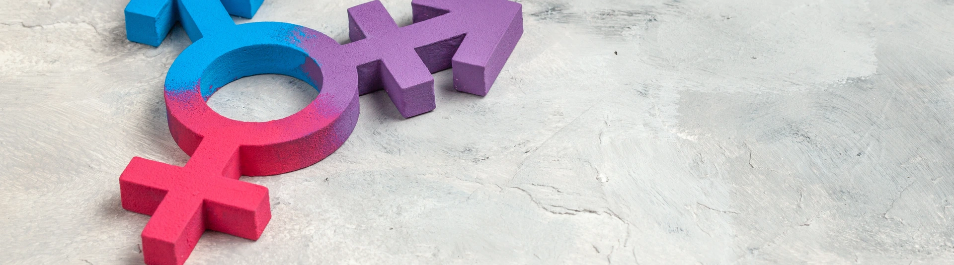 Transgender symbol and gender symbol of man and woman on a gray background.