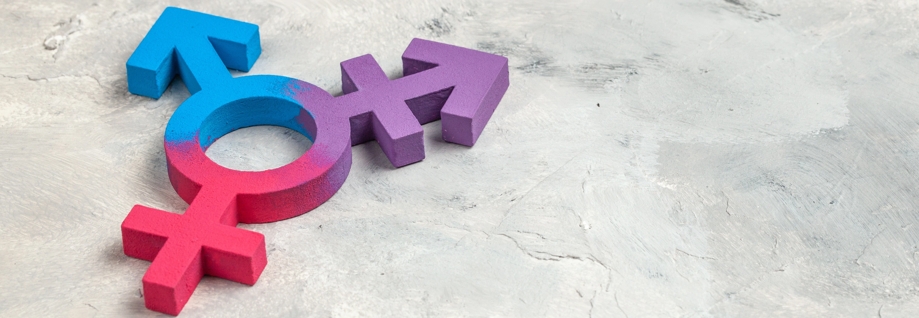 Transgender symbol and gender symbol of man and woman on a gray background.