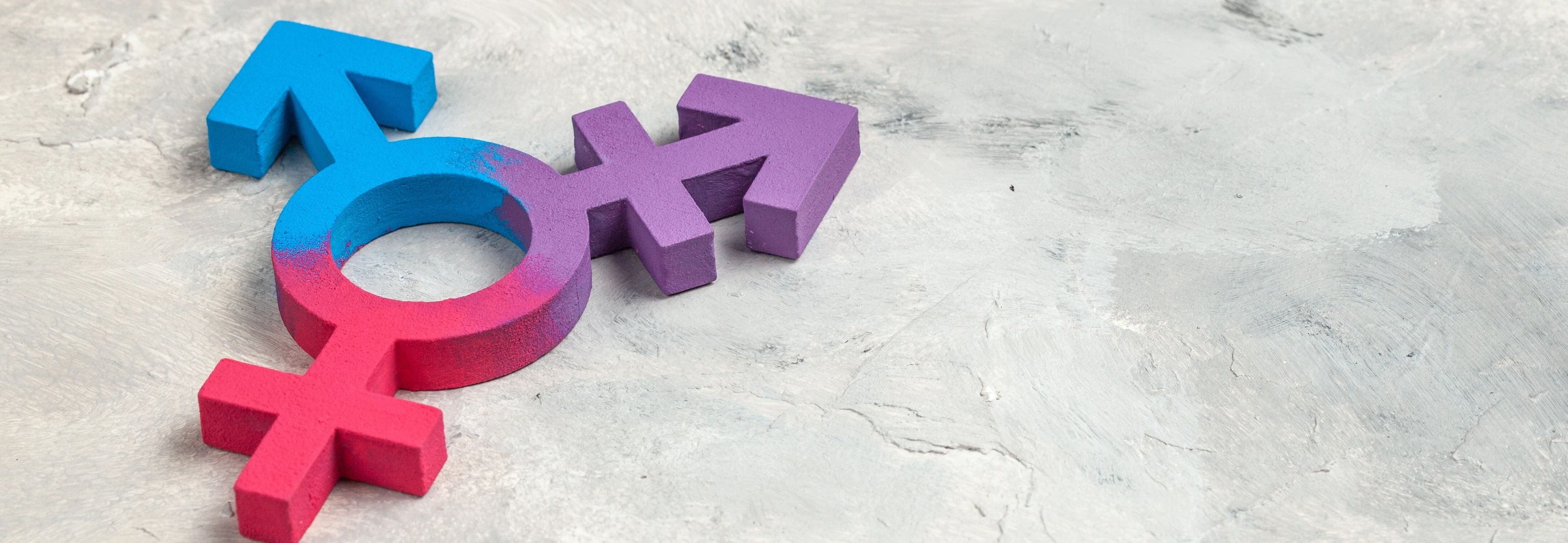 Transgender symbol and gender symbol of man and woman on a gray background.