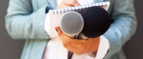 Female reporter with microphone