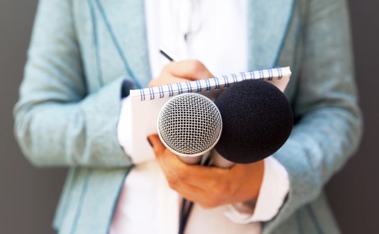 Female reporter with microphone