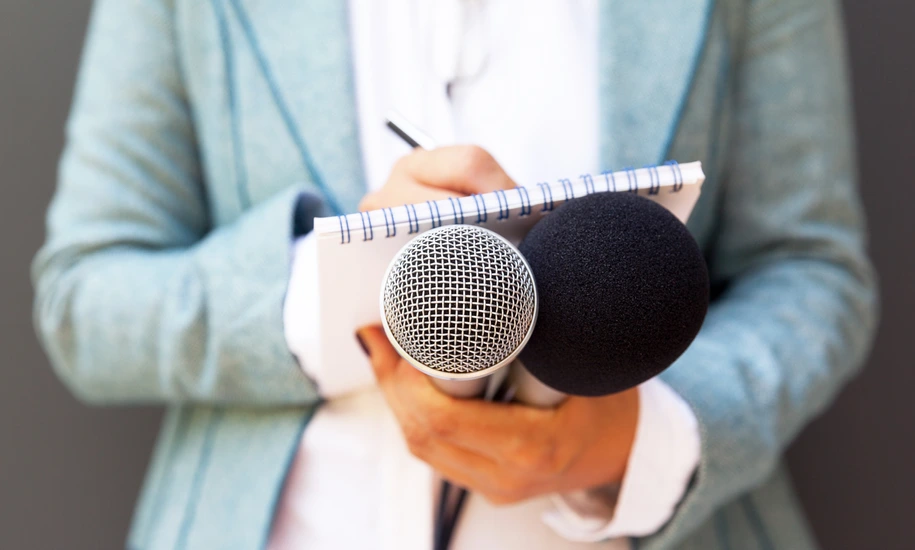Female reporter with microphone