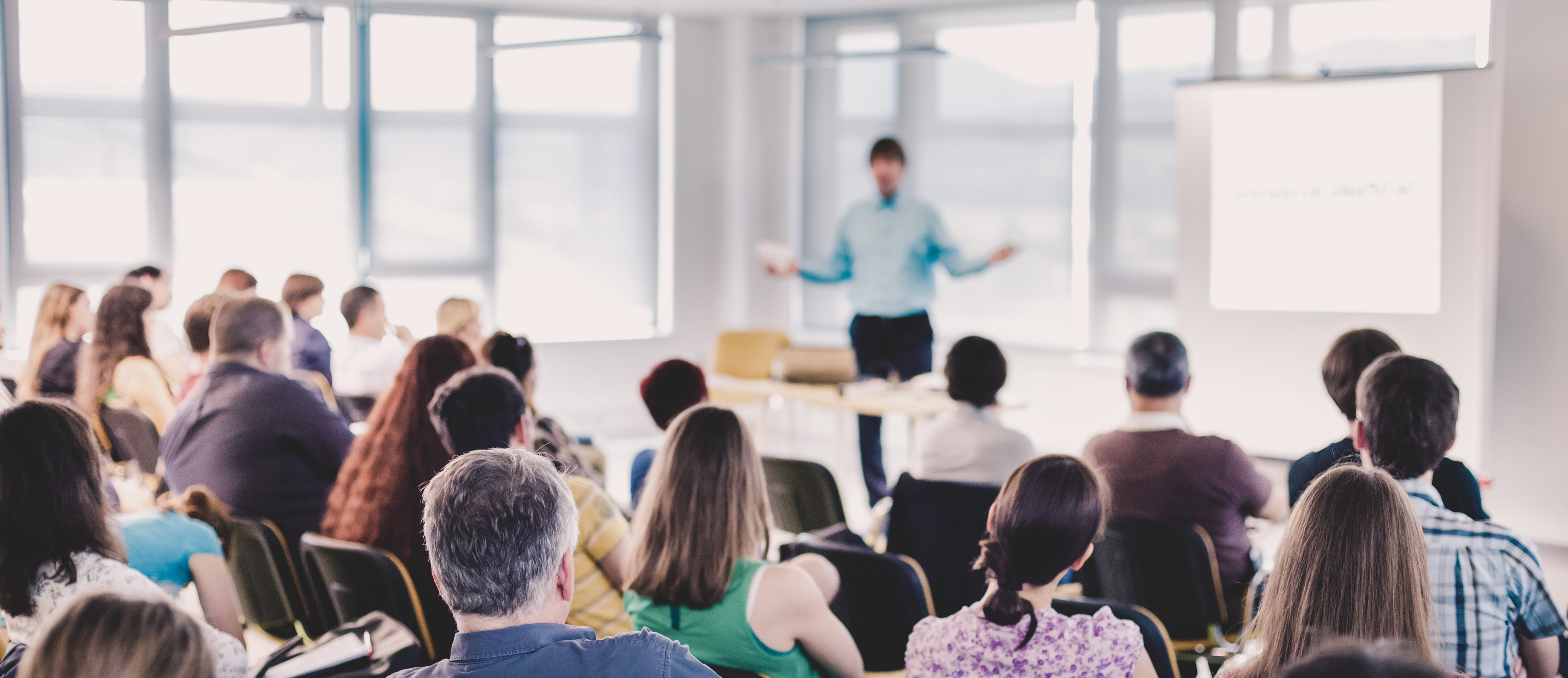 Speakers Giving a Talk at Business Meeting. Audience in the conference hall. Business and Entrepreneurship concept.