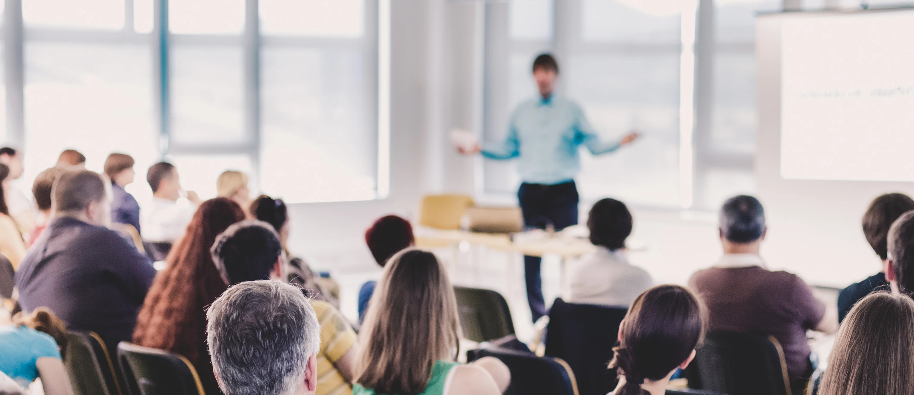 Speaker Giving a Talk at Business Meeting.