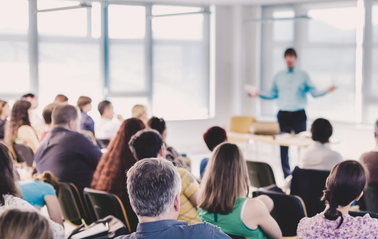 Speaker Giving a Talk at Business Meeting.