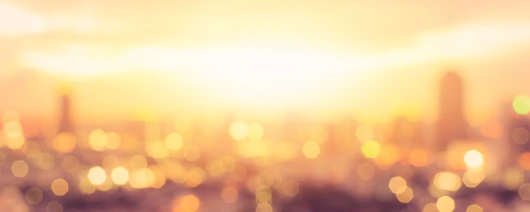 Summer sun blur golden hour hot sunset sky with city rooftop