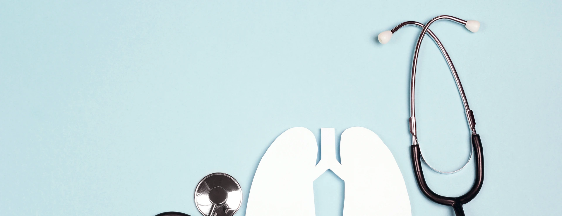 Lungs symbol with stethoscope on blue background. World Tuberculosis Day.