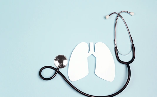 Lungs symbol with stethoscope on blue background. World Tuberculosis Day.