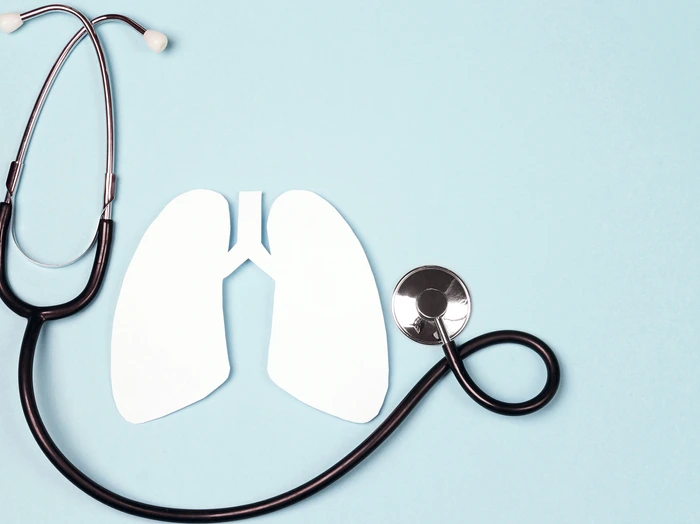 Lungs symbol with stethoscope on blue background. World Tuberculosis Day.