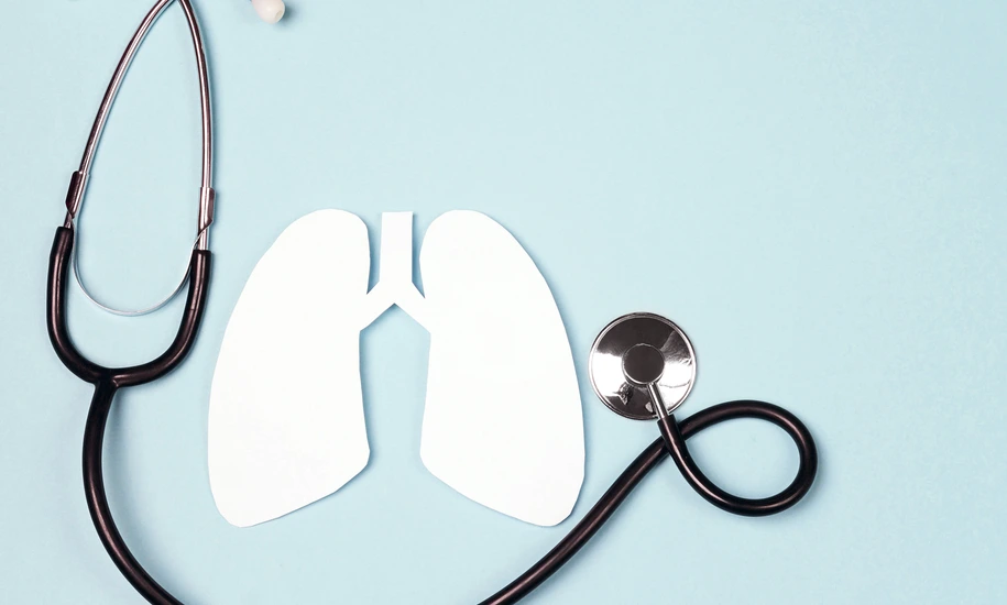 Lungs symbol with stethoscope on blue background. World Tuberculosis Day.