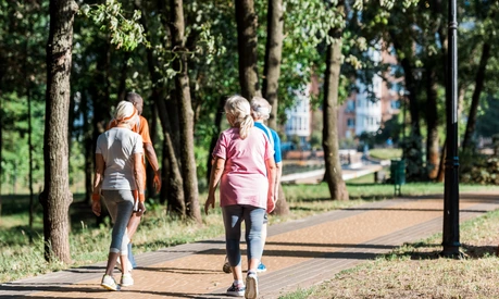 back view of senior women running near multicultural retired men