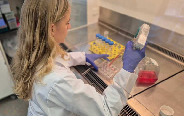 Our doctoral researcher Anne-Marie Bührer performing cell culture
