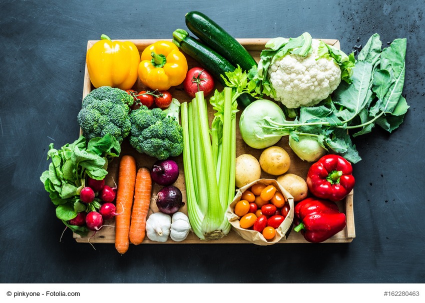 Fresh colorful spring organic vegetables on black