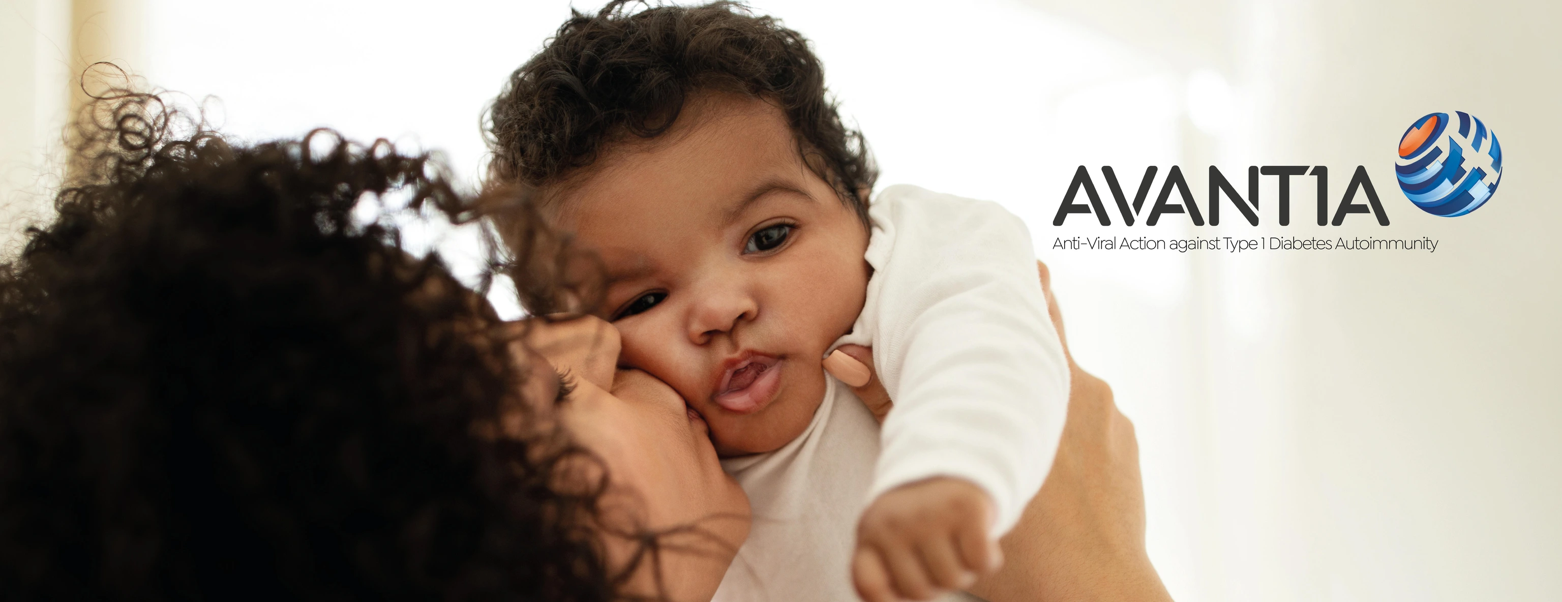 Alias - Happy millennial african american mother kissing little child, enjoy relax together, have fun in bedroom interior