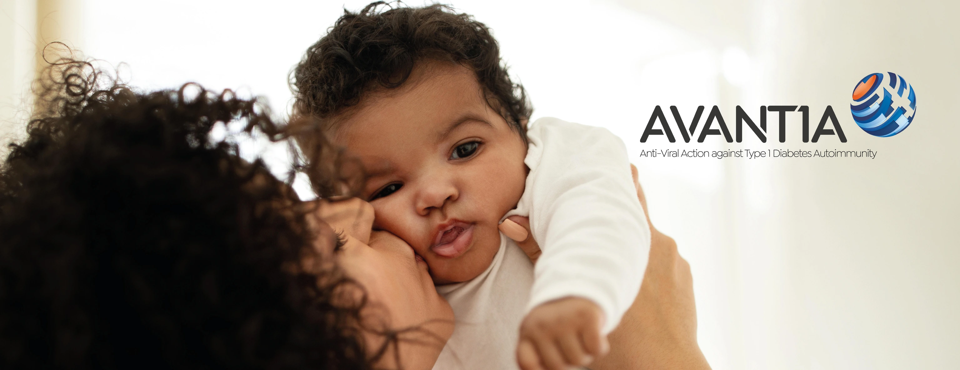 Alias - Happy millennial african american mother kissing little child, enjoy relax together, have fun in bedroom interior